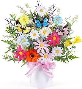 Colorful spring floral arrangement with butterflies and daisies