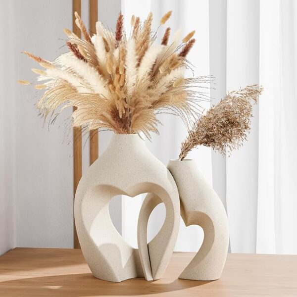 Bohemian dried pampas grass arranged in modern heart-shaped ceramic vases for stylish home decor