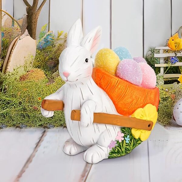 Vintage-style Easter bunny figurine pulling a carrot cart filled with colorful eggs, ideal for spring home décor